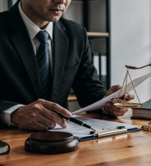 Lawyer Working Document With Scales Justice